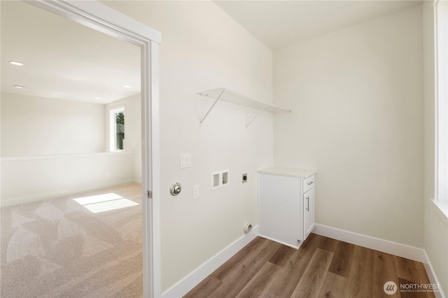 clothes washing area featuring electric dryer hookup, washer hookup, wood finished floors, baseboards, and recessed lighting