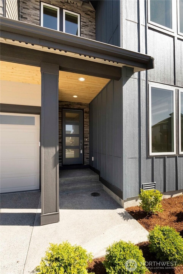 view of exterior entry featuring stone siding