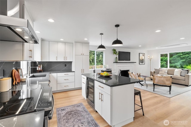 4257 33rd Ave W, Seattle, WA 98199 - kitchen featuring a sink, dark countertops, healthy amount of natural light, beverage cooler, and recessed lighting