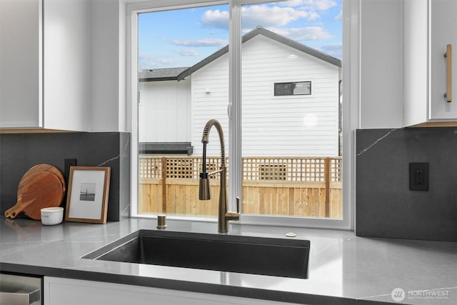 4257 33rd Ave W, Seattle, WA 98199 - kitchen view of a sink, white cabinets, and dark countertops