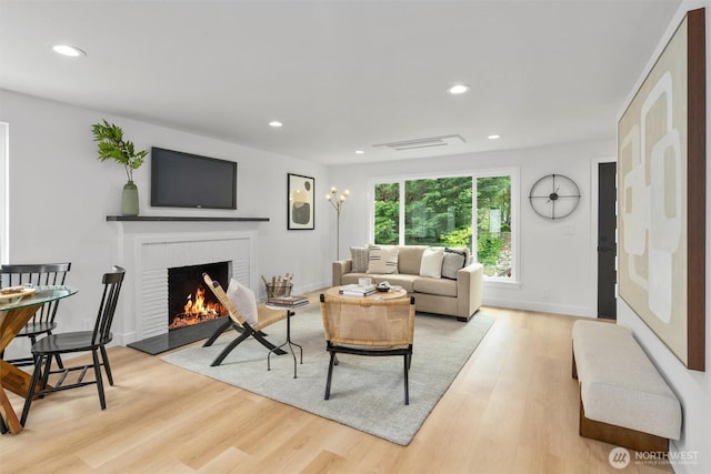 4257 33rd Ave W, Seattle, WA 98199 - living area featuring a fireplace, light wood-type flooring, recessed lighting, and baseboards