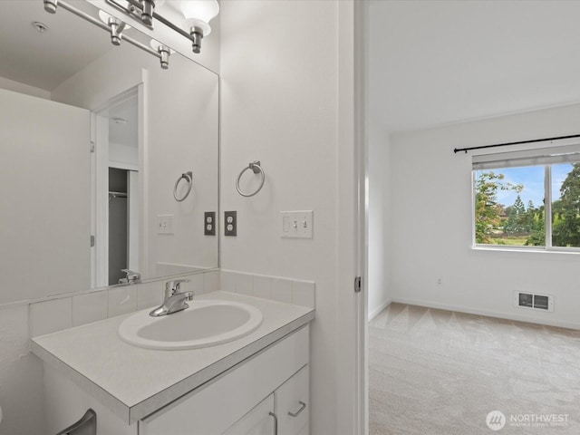 11570 Stone Ave N Unit A-102, Seattle, WA 98133 - bathroom with vanity and baseboards