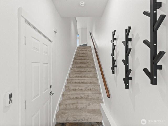 11570 Stone Ave N Unit A-102, Seattle, WA 98133 - stairway with baseboards