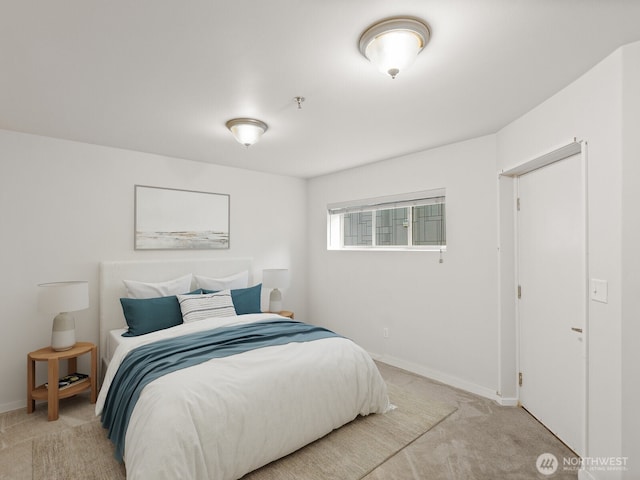 11570 Stone Ave N Unit A-102, Seattle, WA 98133 - bedroom with light colored carpet and baseboards