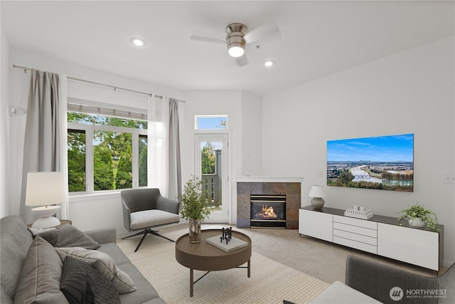 11570 Stone Ave N Unit A-102, Seattle, WA 98133 - carpeted living room featuring ceiling fan, a fireplace, and recessed lighting