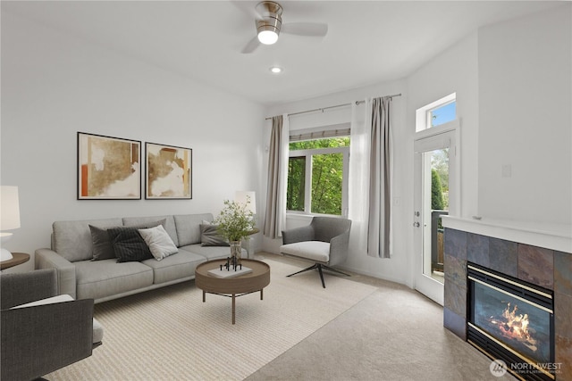 11570 Stone Ave N Unit A-102, Seattle, WA 98133 - living room with light carpet, a tile fireplace, ceiling fan, and recessed lighting