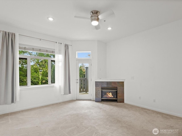 11570 Stone Ave N Unit A-102, Seattle, WA 98133 - unfurnished living room with a ceiling fan, carpet, a tile fireplace, baseboards, and recessed lighting