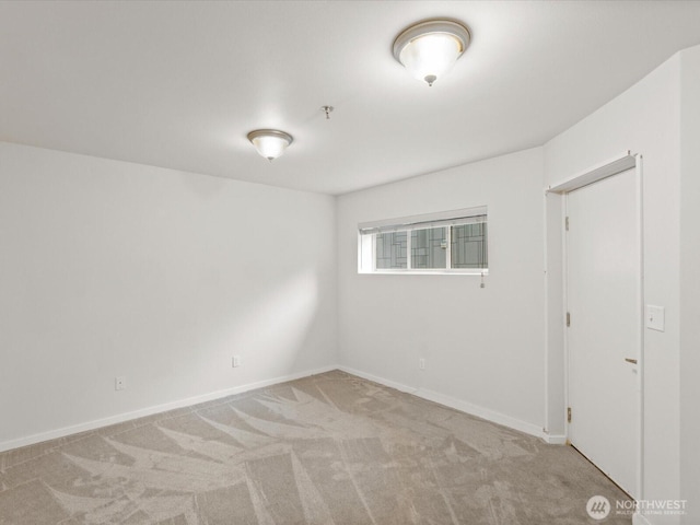 11570 Stone Ave N Unit A-102, Seattle, WA 98133 - spare room with carpet floors and baseboards