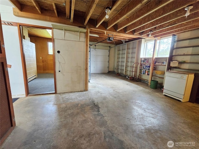 810 H St, Forks, WA 98331 - garage featuring a baseboard heating unit and a garage door opener