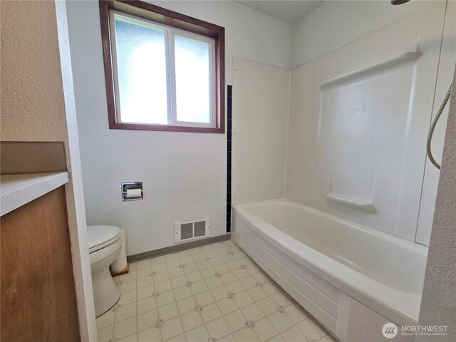810 H St, Forks, WA 98331 - bathroom with toilet, tile patterned floors, and tub / shower combination