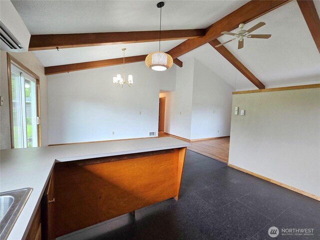 810 H St, Forks, WA 98331 - kitchen with ceiling fan, baseboards, a wall mounted AC, a sink, and hanging light fixtures