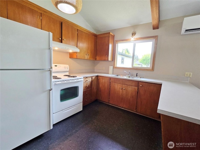 810 H St, Forks, WA 98331 - kitchen featuring white appliances, under cabinet range hood, a sink, brown cabinets, and light countertops