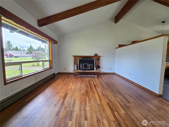 810 H St, Forks, WA 98331 - unfurnished living room with hardwood / wood-style floors, a baseboard radiator, and baseboards