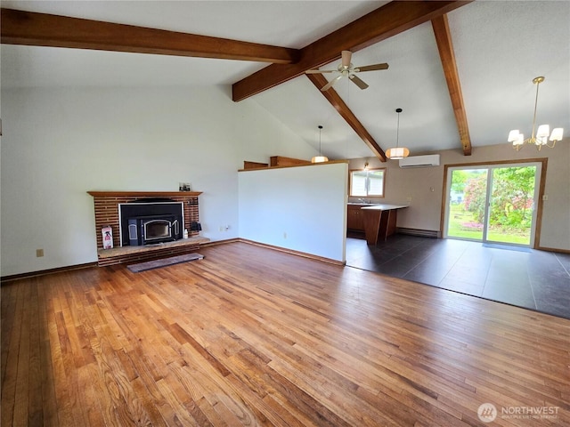 810 H St, Forks, WA 98331 - unfurnished living room with light wood-style flooring, an AC wall unit, a chandelier, ceiling fan, and a baseboard radiator