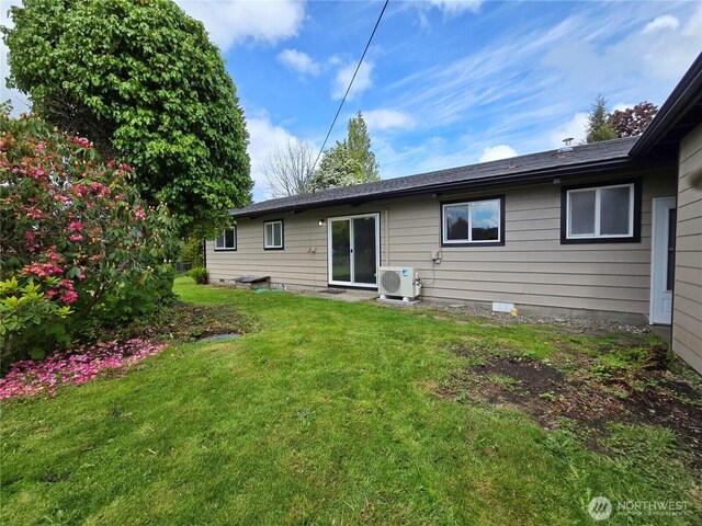 810 H St, Forks, WA 98331 - back of property with a cooling unit and a lawn