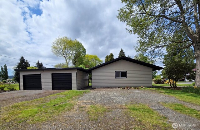 810 H St, Forks, WA 98331 - view of property exterior with an outbuilding and a garage