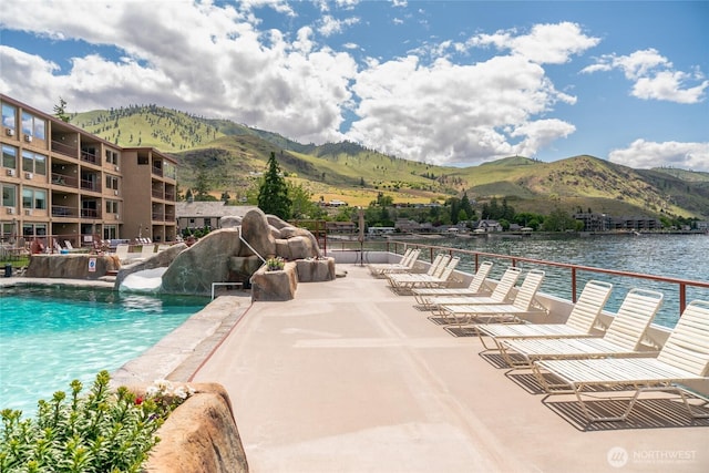 322 W Woodin Ave Unit 711, Chelan, WA 98816 - community pool featuring a water slide, a patio, and a water and mountain view