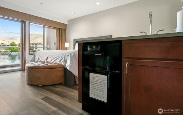 322 W Woodin Ave Unit 711, Chelan, WA 98816 - kitchen featuring wood finished floors, beverage cooler, a sink, and recessed lighting