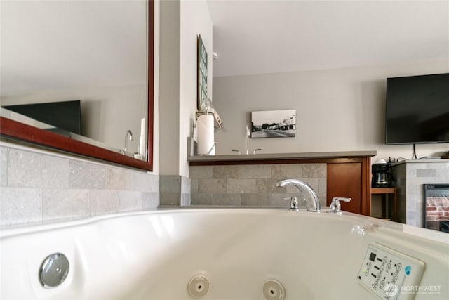 322 W Woodin Ave Unit 711, Chelan, WA 98816 - detailed view of a tiled fireplace and a whirlpool tub