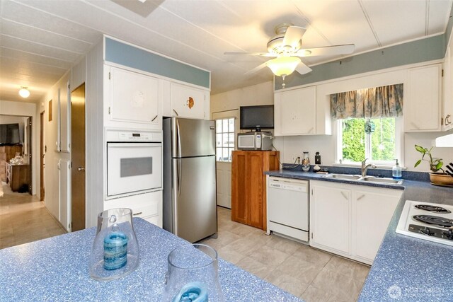 2101 S 324th St Unit 136, Federal Way, WA 98003 - kitchen featuring white appliances, a sink, white cabinetry, and ceiling fan