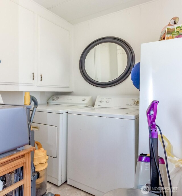 2101 S 324th St Unit 136, Federal Way, WA 98003 - laundry area with washing machine and dryer, cabinet space, and light tile patterned floors