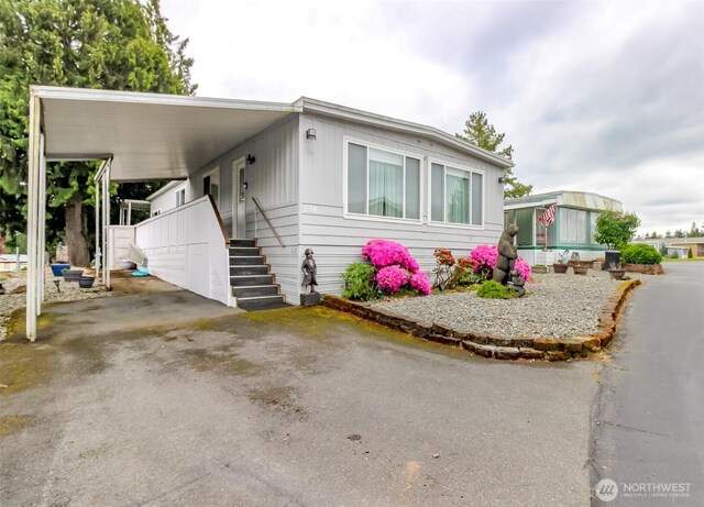2101 S 324th St Unit 136, Federal Way, WA 98003 - manufactured / mobile home with a carport and driveway