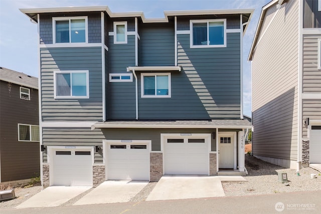 2450 Zeeden Way, Bremerton, WA 98310 - view of front of home featuring driveway, a garage, and stone siding