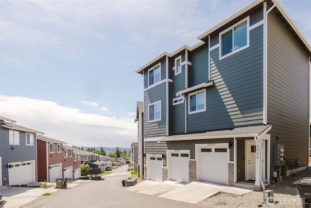 2450 Zeeden Way, Bremerton, WA 98310 - view of property exterior featuring an attached garage, a residential view, and driveway