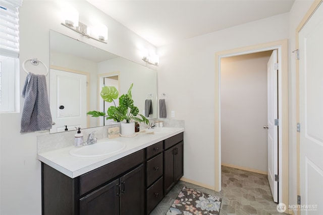 2450 Zeeden Way, Bremerton, WA 98310 - bathroom featuring double vanity and baseboards