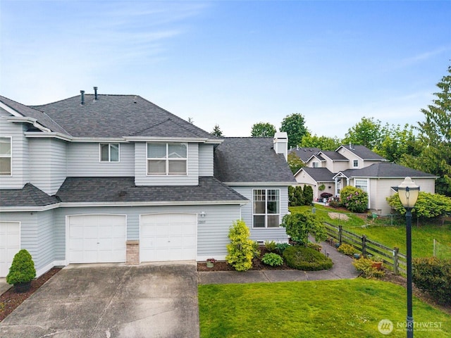 12015 SE 312th Pl Unit 7D, Auburn, WA 98092 - traditional-style home with concrete driveway, an attached garage, and a shingled roof