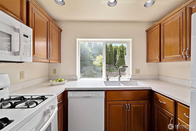 12015 SE 312th Pl Unit 7D, Auburn, WA 98092 - kitchen featuring white appliances, a sink, recessed lighting, and brown cabinets