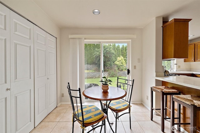 12015 SE 312th Pl Unit 7D, Auburn, WA 98092 - dining space with light tile patterned floors, recessed lighting, and baseboards
