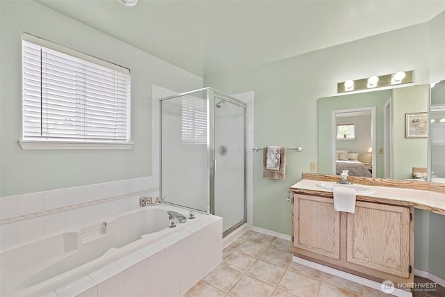 12015 SE 312th Pl Unit 7D, Auburn, WA 98092 - ensuite bathroom featuring a bath, a stall shower, vanity, and tile patterned flooring