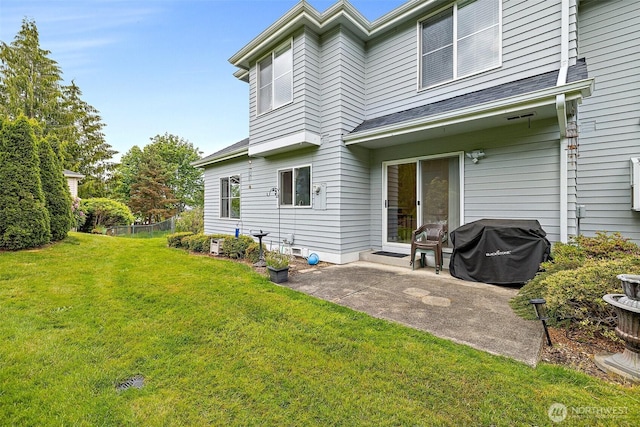 12015 SE 312th Pl Unit 7D, Auburn, WA 98092 - back of property featuring a lawn and a patio area