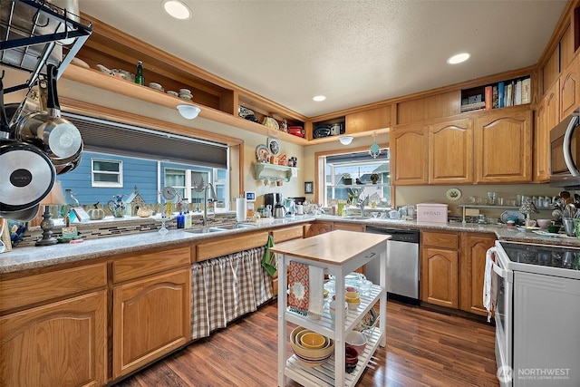 1027 S 60th St, Tacoma, WA 98408 - kitchen with appliances with stainless steel finishes, a sink, open shelves, light countertops, and recessed lighting