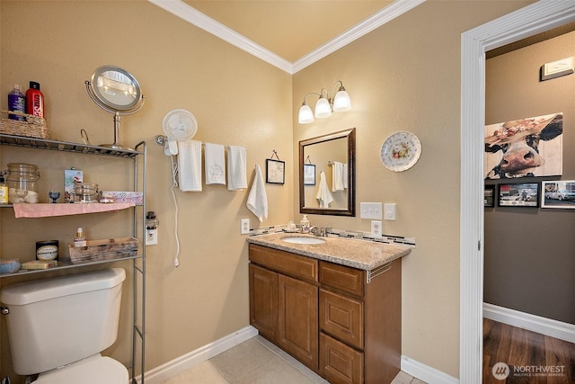 1027 S 60th St, Tacoma, WA 98408 - bathroom featuring ornamental molding, toilet, baseboards, vanity, and tile patterned flooring