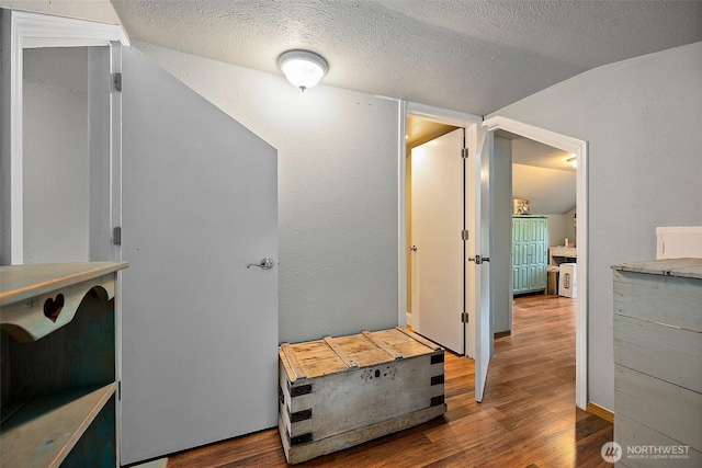 1027 S 60th St, Tacoma, WA 98408 - mudroom with vaulted ceiling, wood finished floors, and a textured ceiling