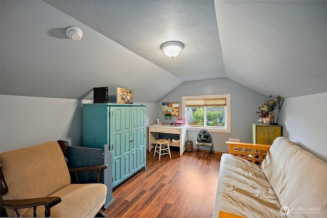 1027 S 60th St, Tacoma, WA 98408 - home office featuring wood finished floors, vaulted ceiling, and a textured ceiling
