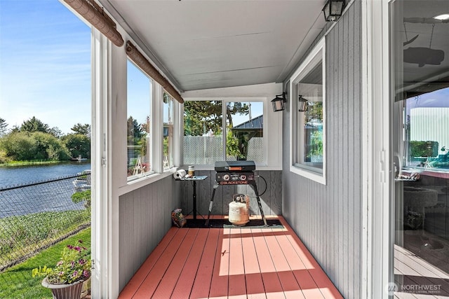 157 Canal Dr NE, Ocean Shores, WA 98569 - sunroom featuring a water view, lofted ceiling, hardwood / wood-style flooring, and healthy amount of natural light