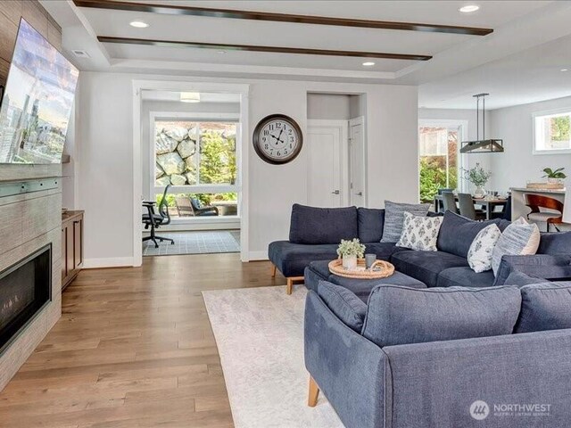 11550 174th Ave NE, Redmond, WA 98052 - living room featuring light wood finished floors, baseboards, a tray ceiling, and recessed lighting