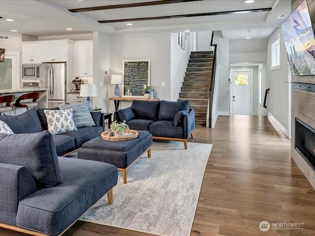 11550 174th Ave NE, Redmond, WA 98052 - living room featuring stairs, wood finished floors, recessed lighting, and baseboards