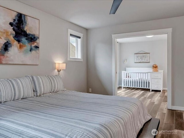 11550 174th Ave NE, Redmond, WA 98052 - bedroom featuring wood finished floors, baseboards, and ceiling fan