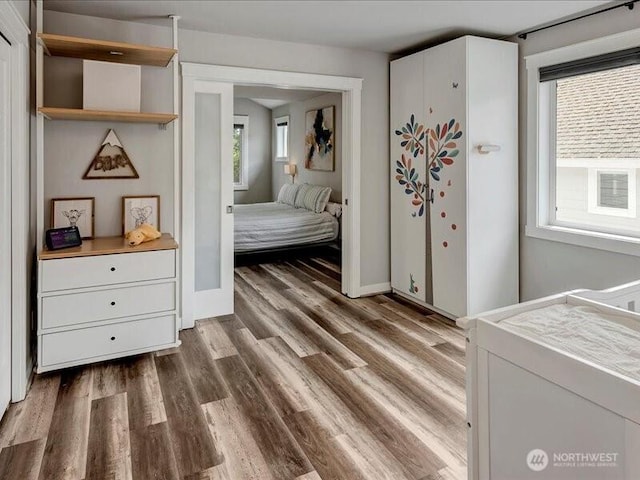 11550 174th Ave NE, Redmond, WA 98052 - bedroom with wood finished floors and baseboards