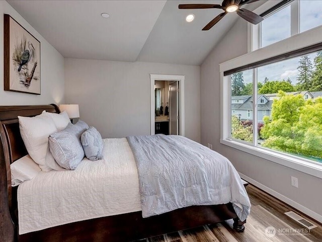 11550 174th Ave NE, Redmond, WA 98052 - bedroom with vaulted ceiling, wood finished floors, recessed lighting, connected bathroom, and baseboards