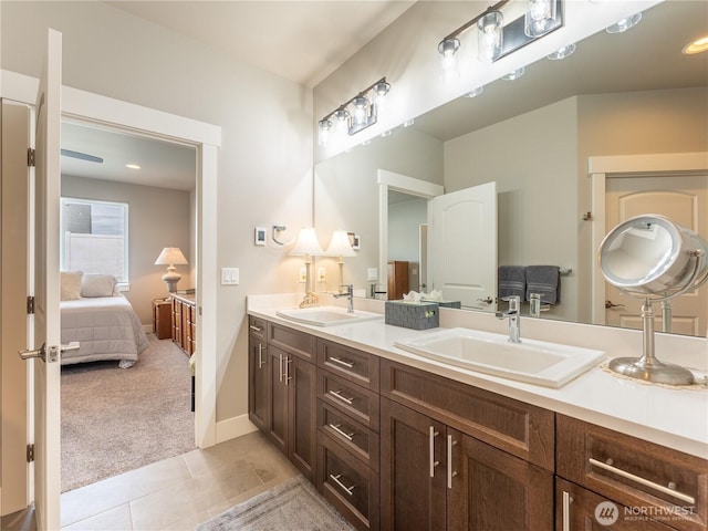 2611 Paisley St SE, East Wenatchee, WA 98802 - ensuite bathroom featuring tile patterned floors, double vanity, and baseboards