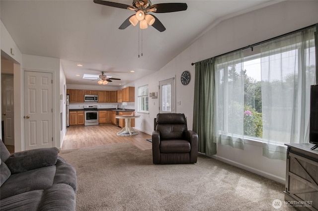 184 Frigate St NW, Ocean Shores, WA 98569 - living area with baseboards, ceiling fan, light carpet, recessed lighting, and lofted ceiling