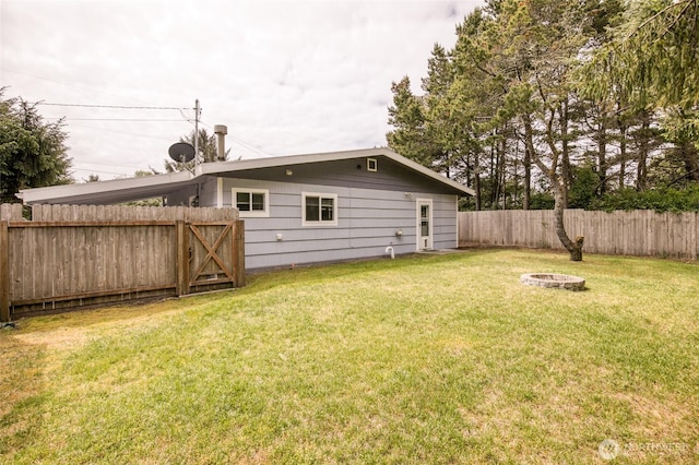 184 Frigate St NW, Ocean Shores, WA 98569 - view of yard with an outdoor fire pit