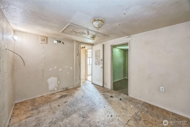 3122 Oas Dr W, University Place, WA 98466 - empty room with attic access and a textured ceiling