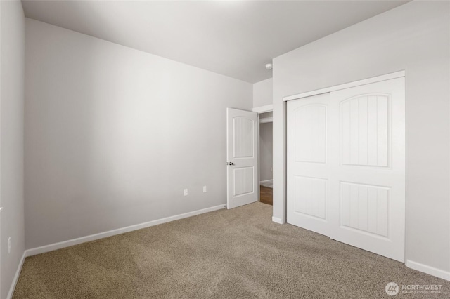 546 S Driftwood Ln, Moses Lake, WA 98837 - unfurnished bedroom featuring carpet flooring, a closet, and baseboards