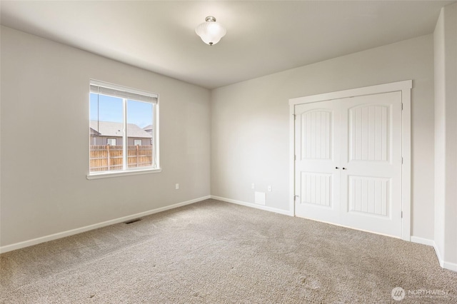 546 S Driftwood Ln, Moses Lake, WA 98837 - unfurnished bedroom featuring carpet floors, baseboards, and a closet
